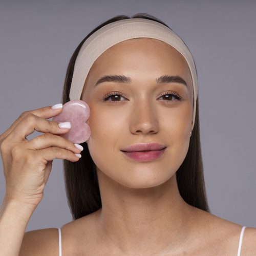 front-view-young-woman-posing-studio_Guasha